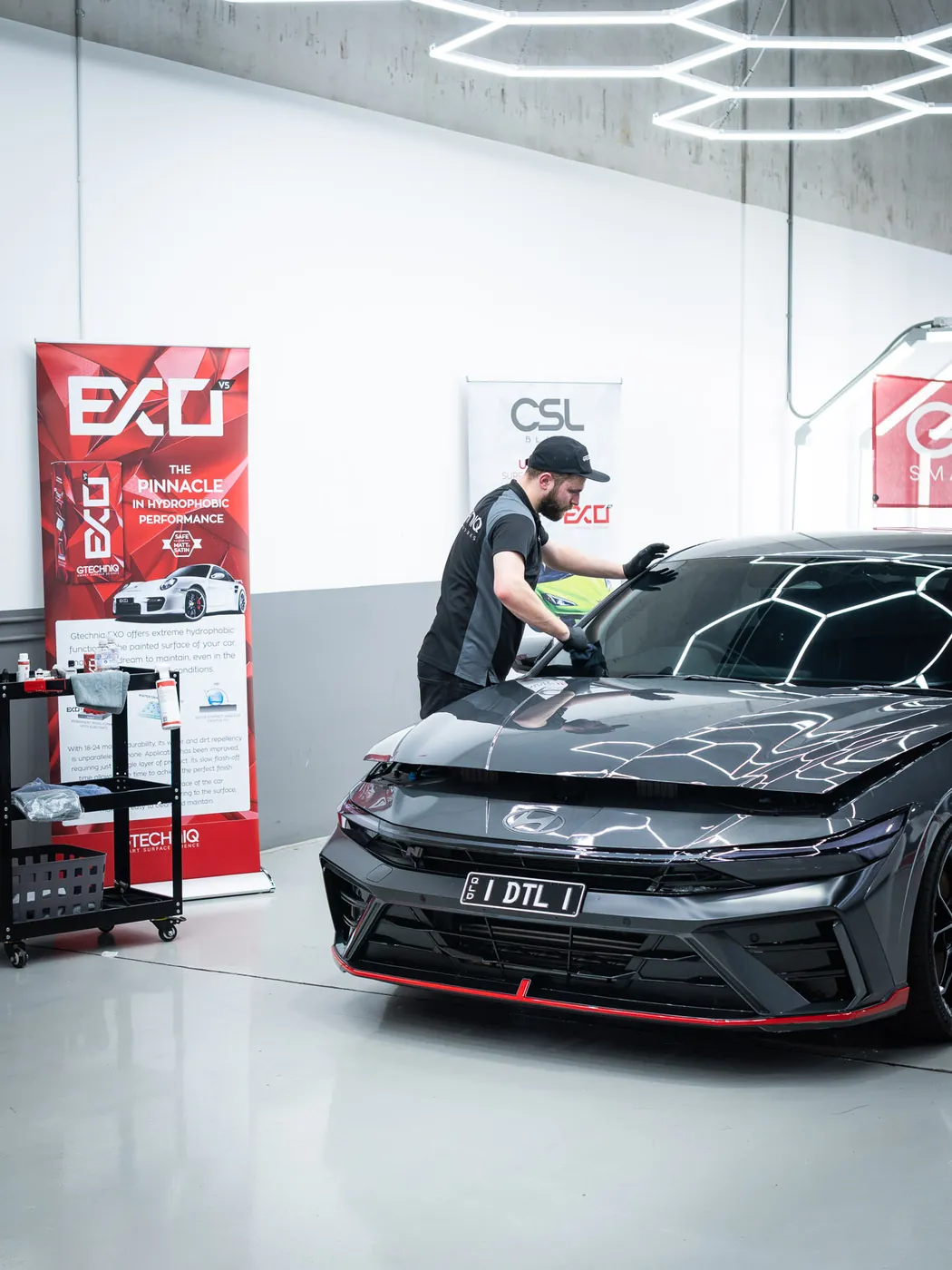 Gtechniq coating demonstration on a new car at Deluxe Detail