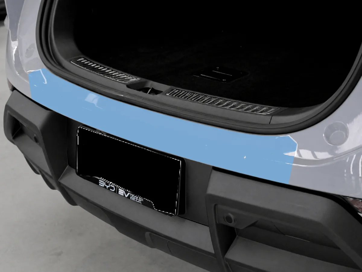 Paint protection film applied to the rear luggage strip of a car