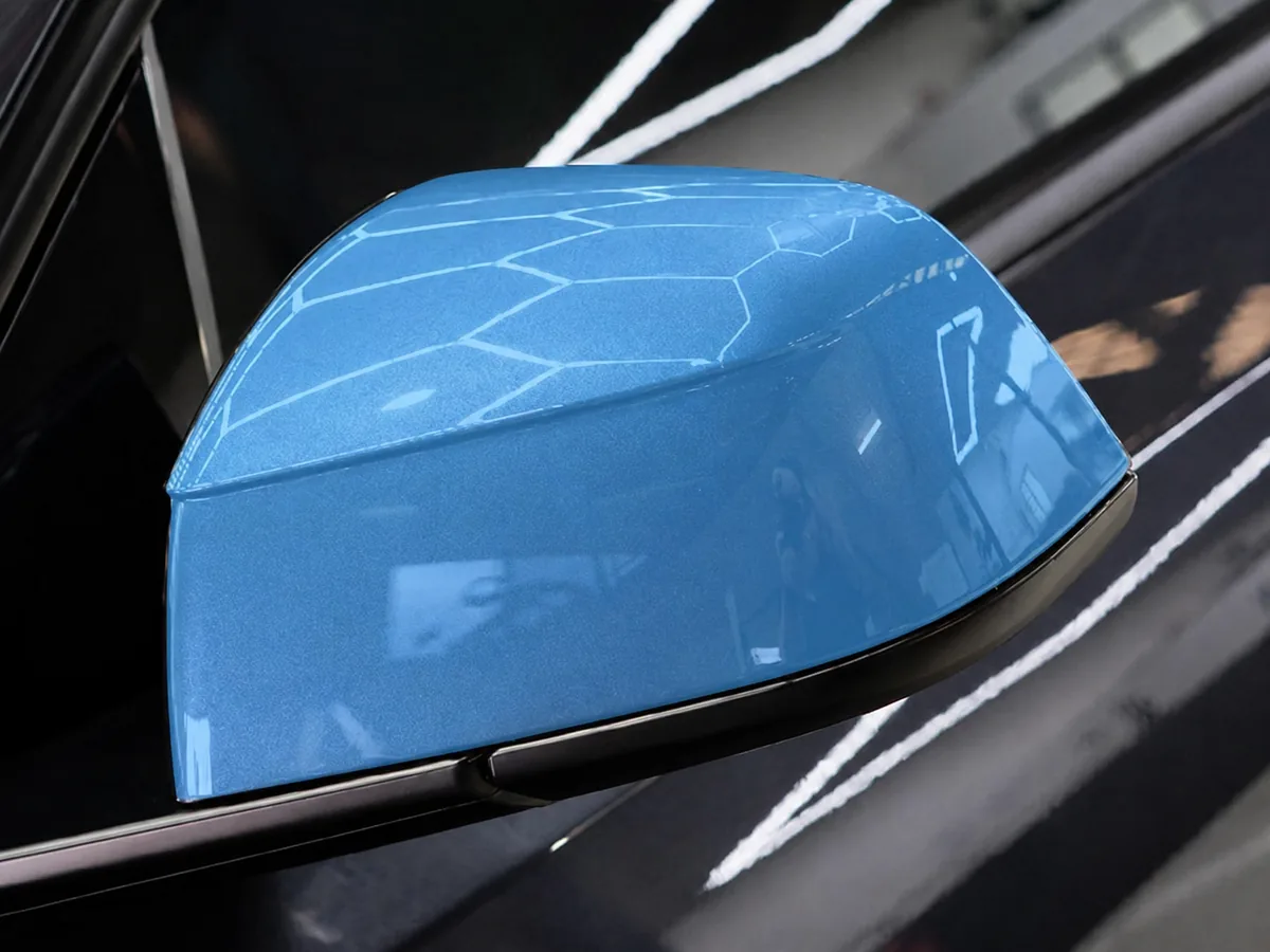 PPF applied to the mirror cap of a Tesla Model Y