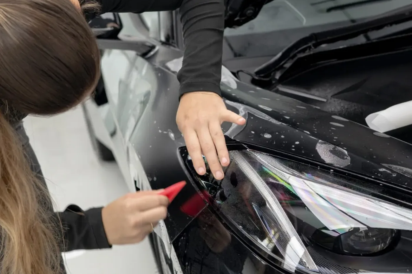 Paint protection film worked around a panel edge