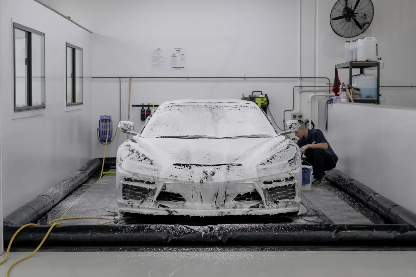 Snow foam covering a car before the contact wash