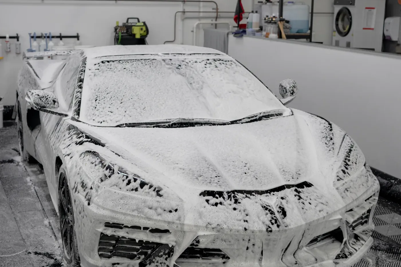 Car undergoing an intensive strip wash before coating
