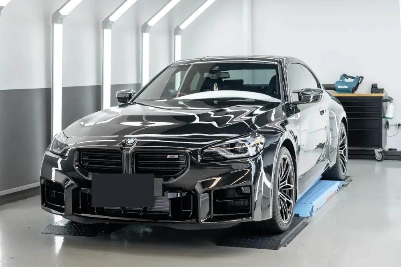 Car in the Deluxe Detail studio under the lights