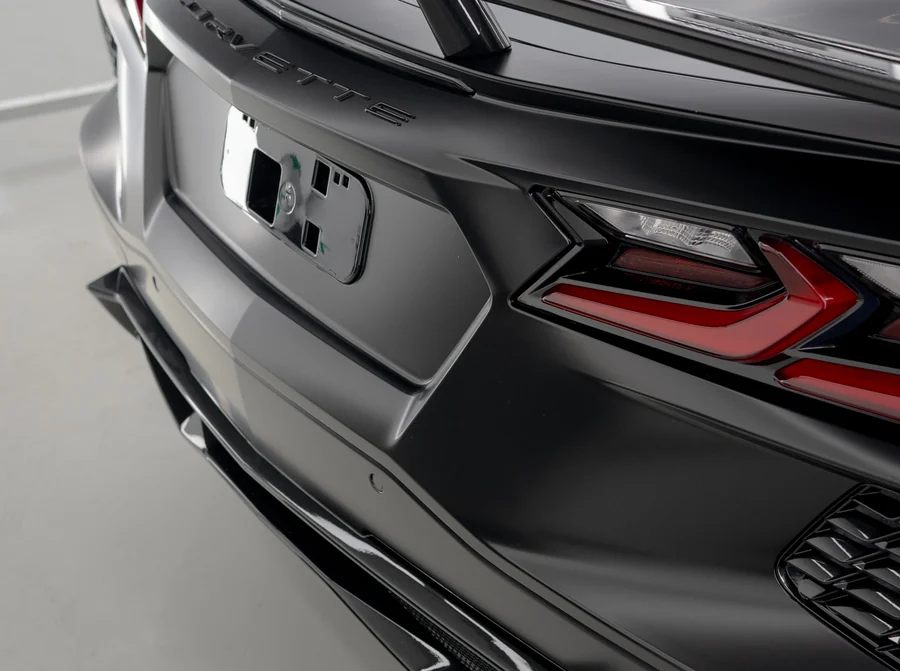 Satin PPF holding a soft highlight along the rear deck of a Chevrolet Corvette