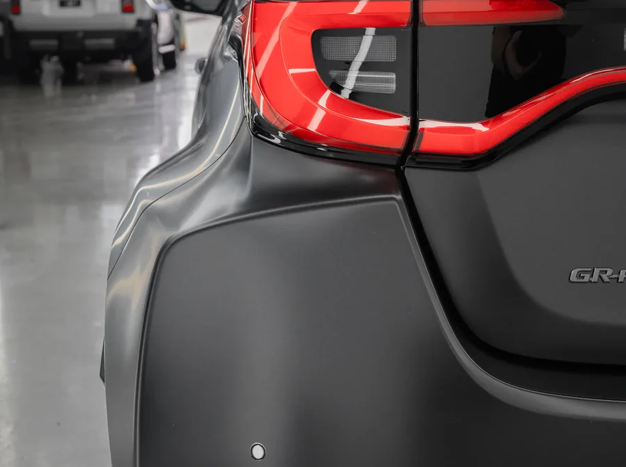Satin PPF cut around the vents and badges on a Toyota GR Yaris
